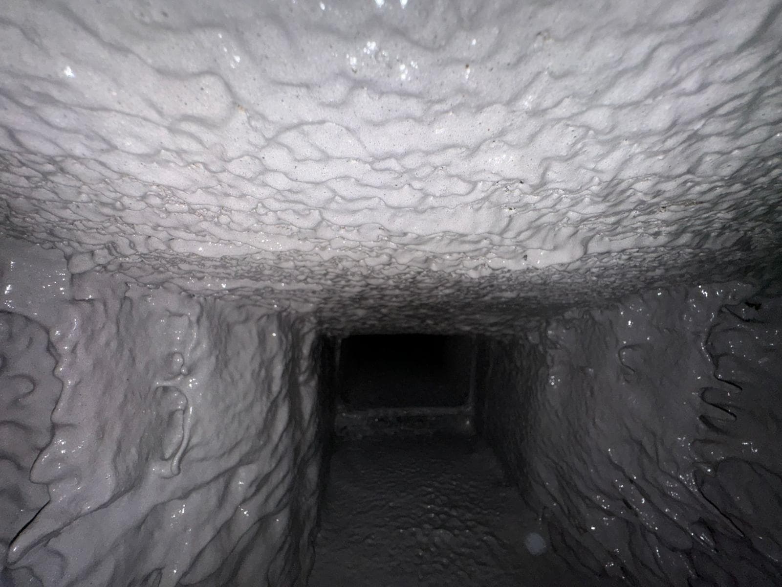 The same smoke chamber after parging, with a smooth sealed surface